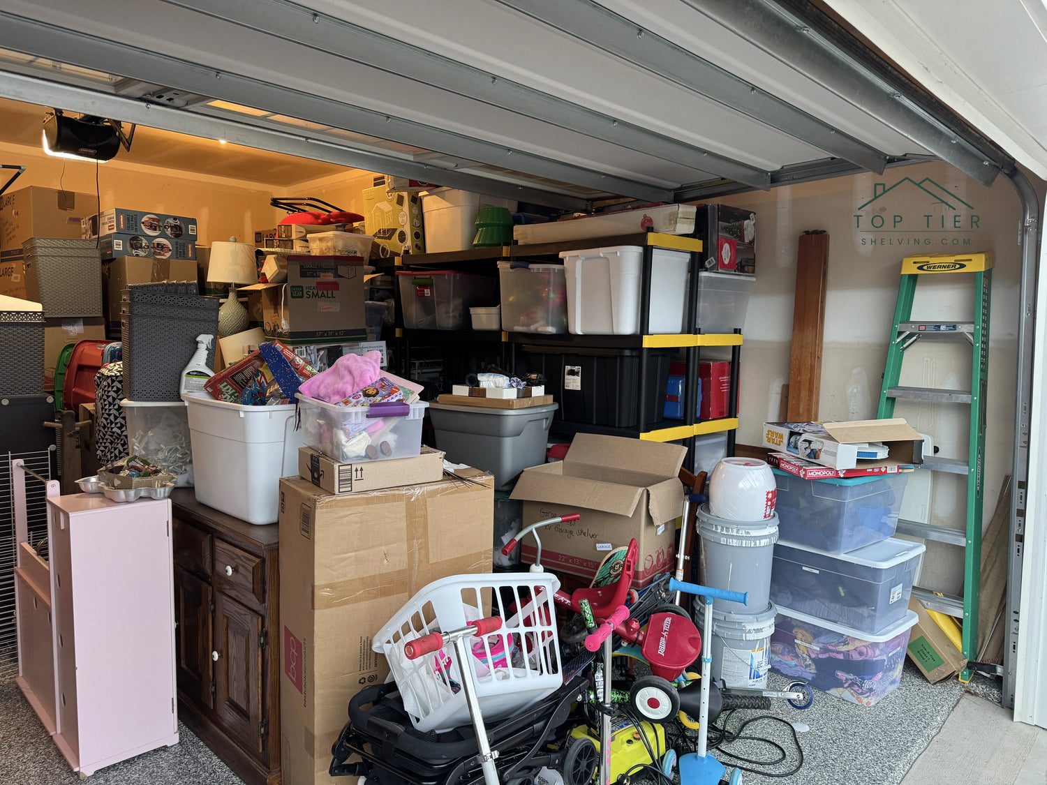 Cluttered garage in Raleigh North Carolina with storage bins and boxes on the floor