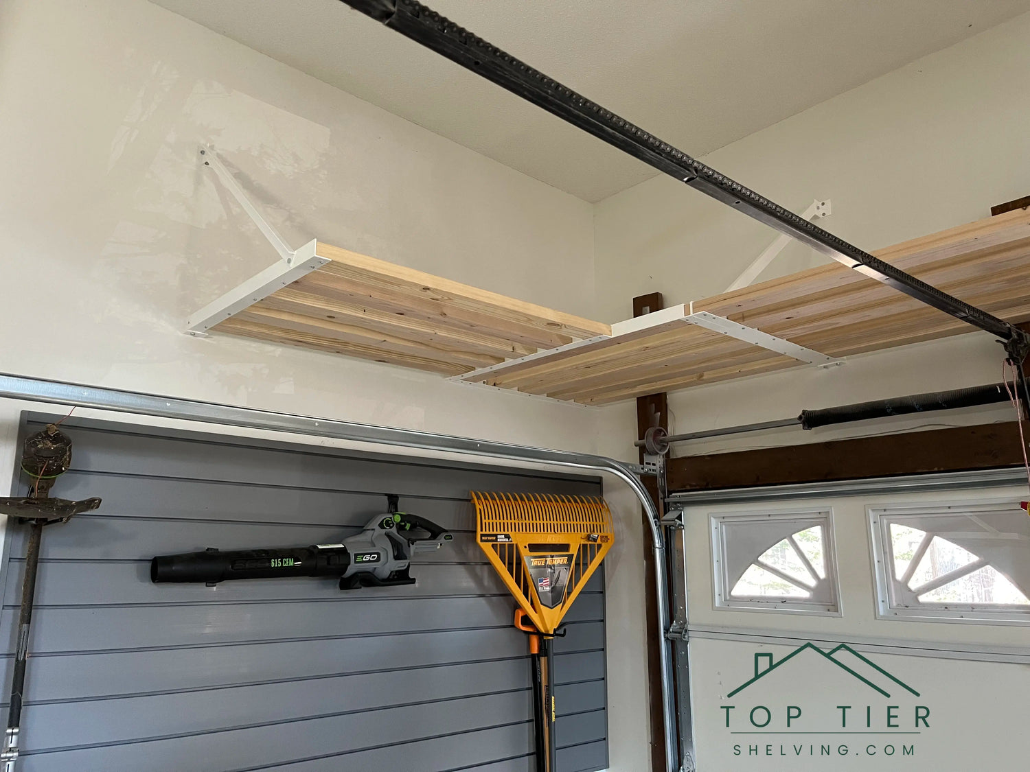 residential garage solution with high-capacity 4-foot shelving sections professional installation