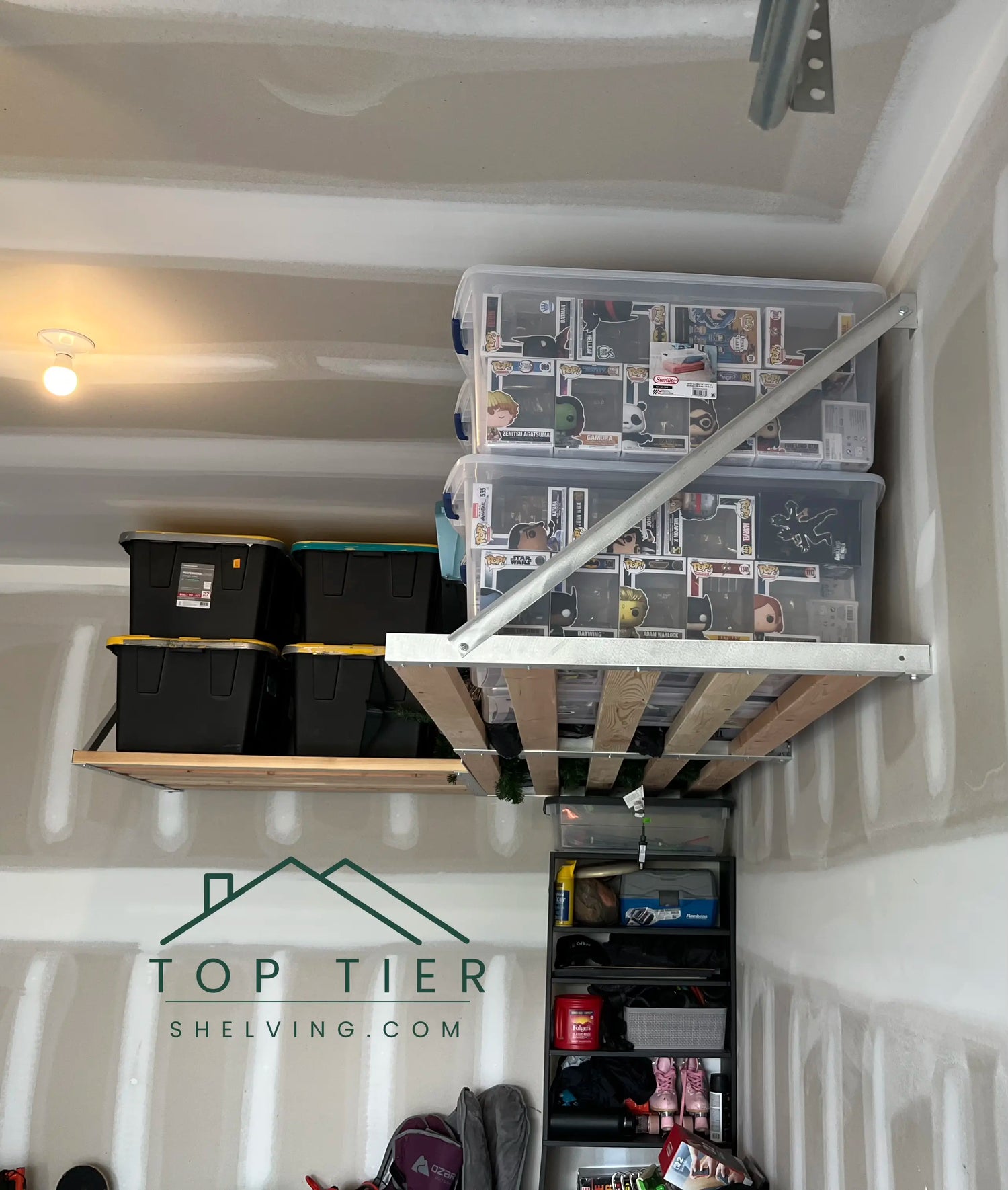 heavy-duty garage storage shelving system holding plastic totes in a single-car garage